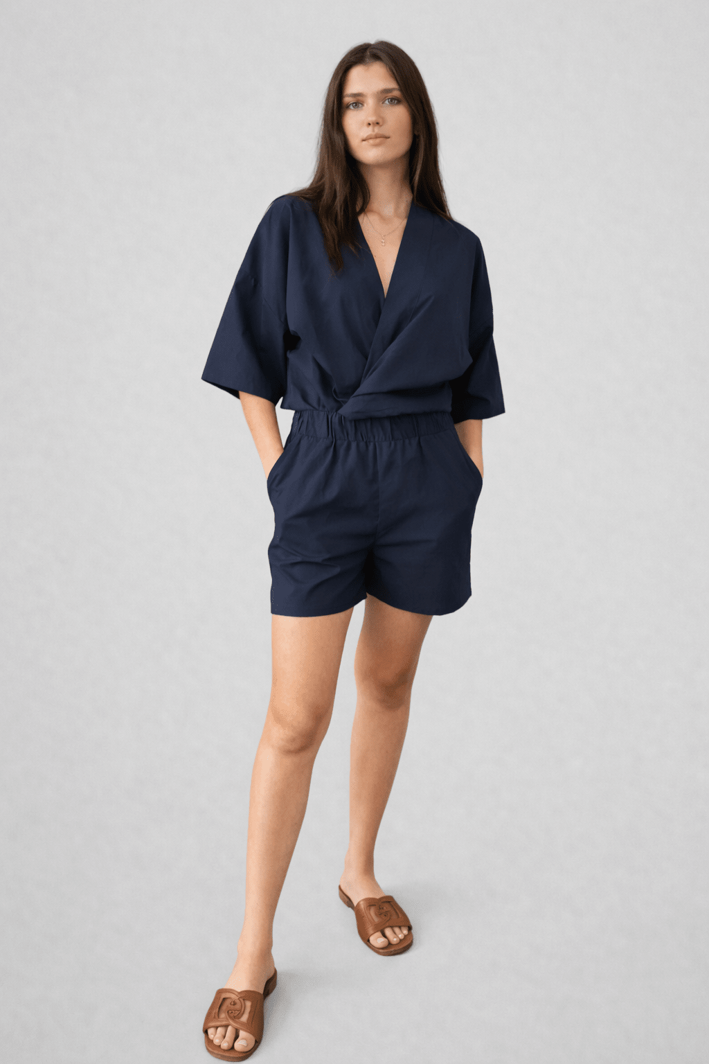 Relaxed, 100% cotton, 3/4 sleeve, tie top with snap button closure. 