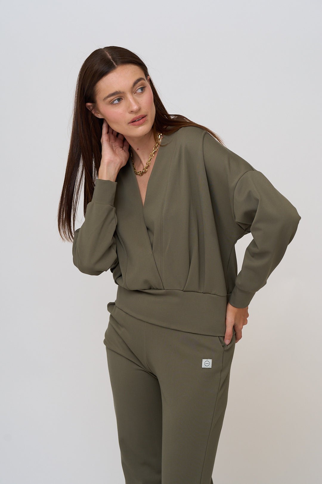 Long sleeve, deep v-neck top for women in Moss, a soft green.