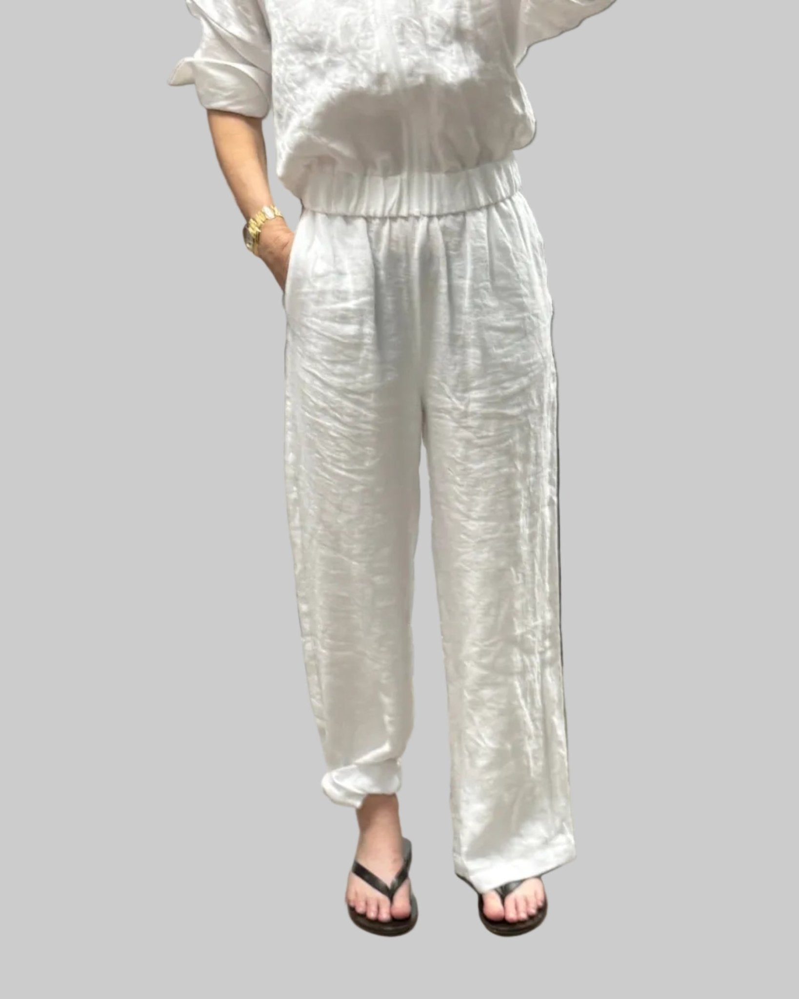 High waist, wide leg white linen pant with pockets and elastic waist band and adjustable hem for joggers with snaps
